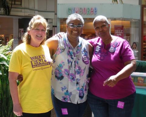 3 women standing at event