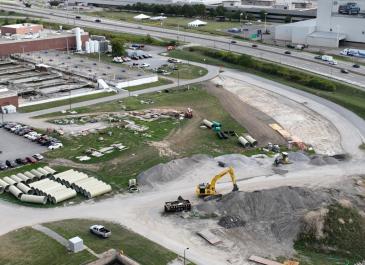 Site work on the south end of the facility (facing northeast) – new 72” diameter piping is staged on the left side of the image