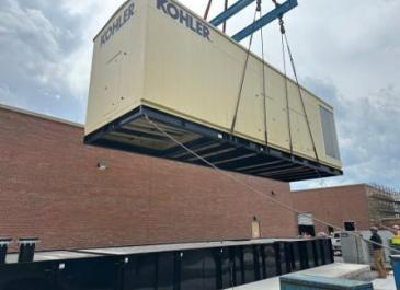 New 2.5 MW generator being lowered into position (facing southwest)