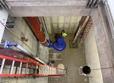 One of the effluent pumps being installed