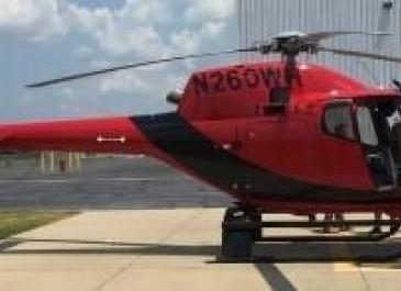 Red helicopter used to distribute oral rabies vaccination pellets