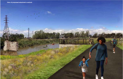 woman and child on asphalt path along a creek