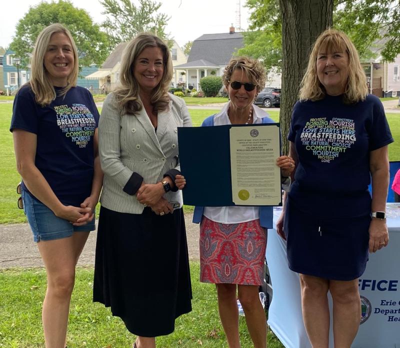 Jamee Felt and Katie Constantino from Catholic Charities receive a proclamation for World Breastfeeding Week from Deputy County Executive Lisa Chimera and Commissioner of Health Dr. Gale Burstein