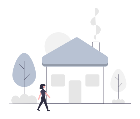 person walking past a home with smoke coming from the chimney